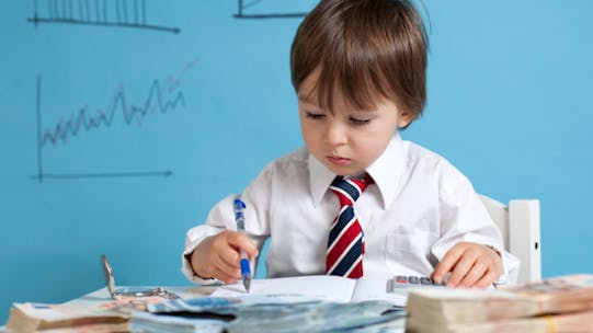 Image of a young boy calculating returns