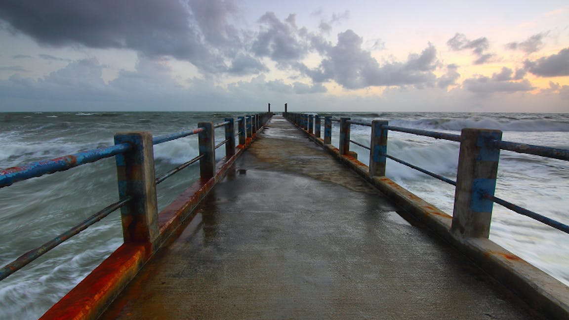 Pier out into stormy seas