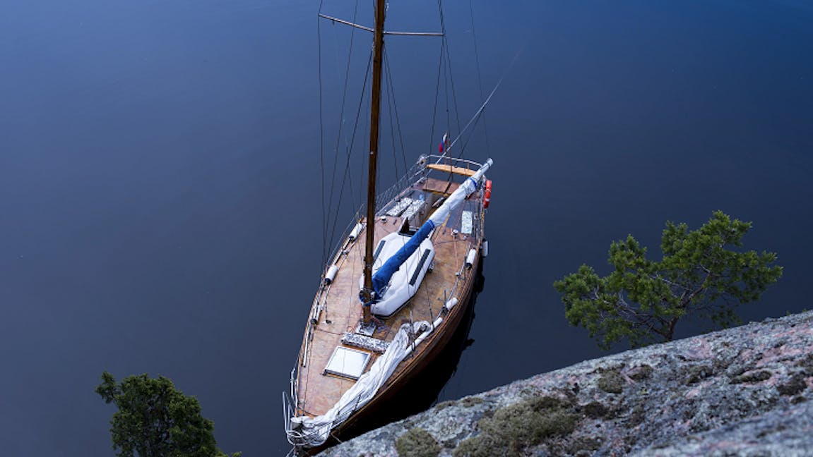 Yacht moored off coast