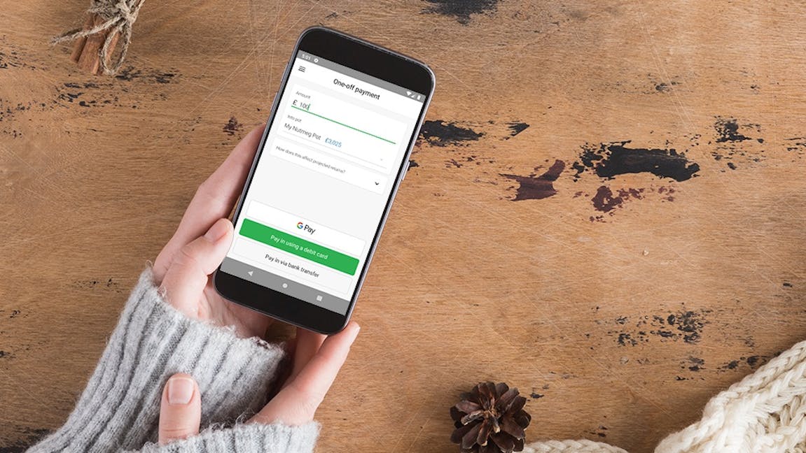 A mobile phone with the Google Pay button on the Nutmeg app