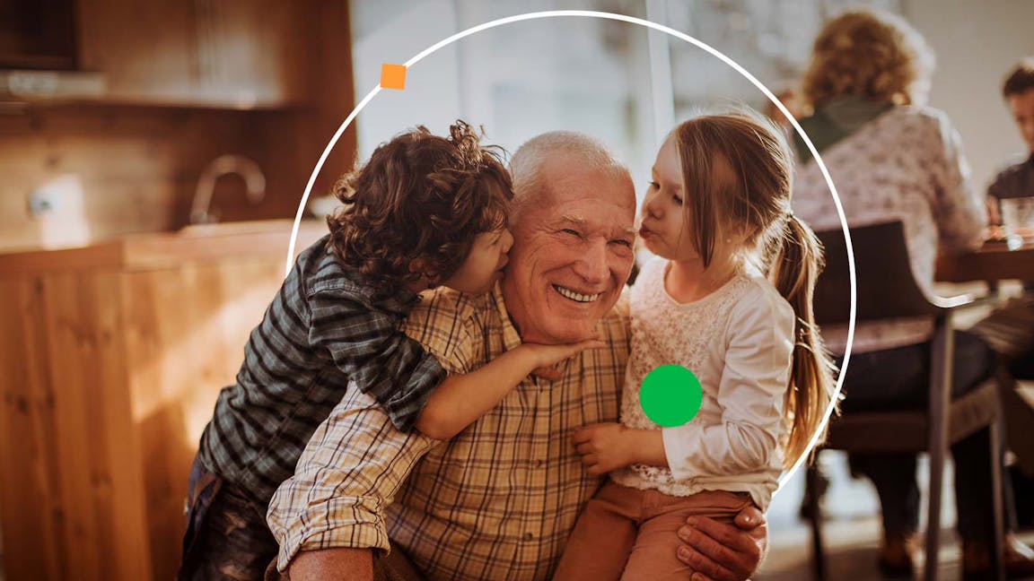 Grandparent hugging grandchildren