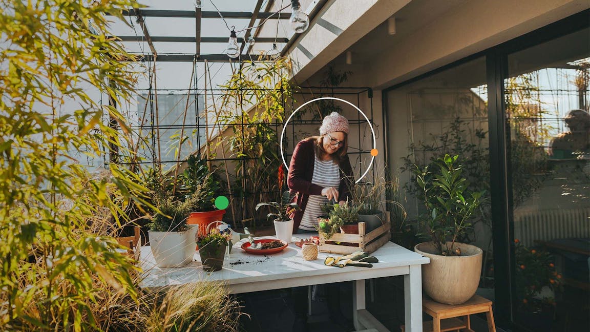 Mature lady garden in a greenhouse