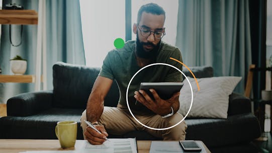 A man calculating his state pension information on a tablet