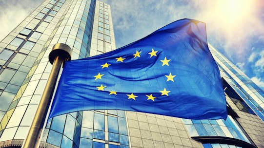 EU flag in front of European Parliament buildings