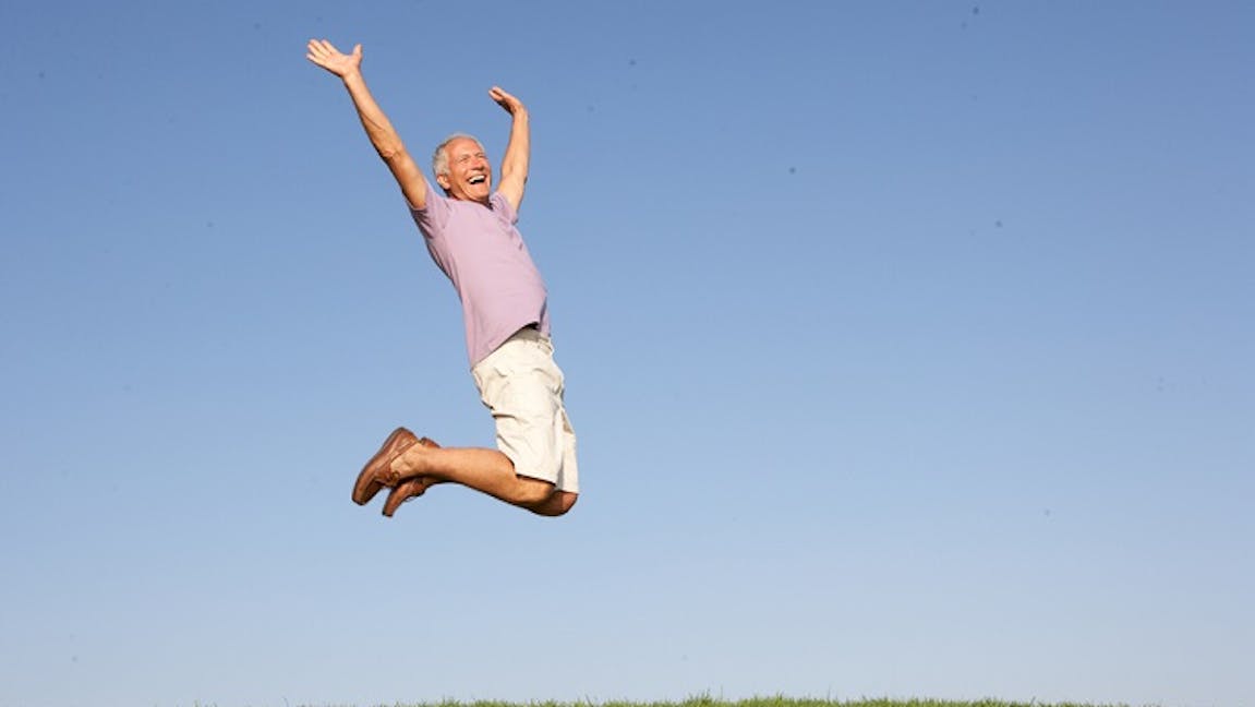 Retired man jumping