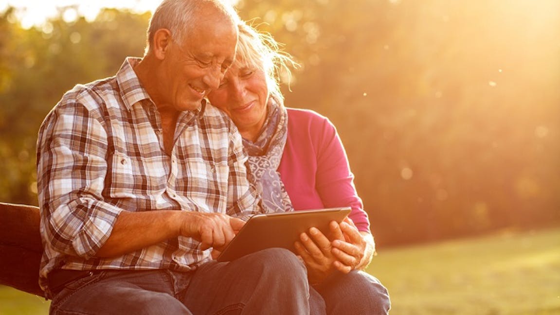 Retired couple with iPad