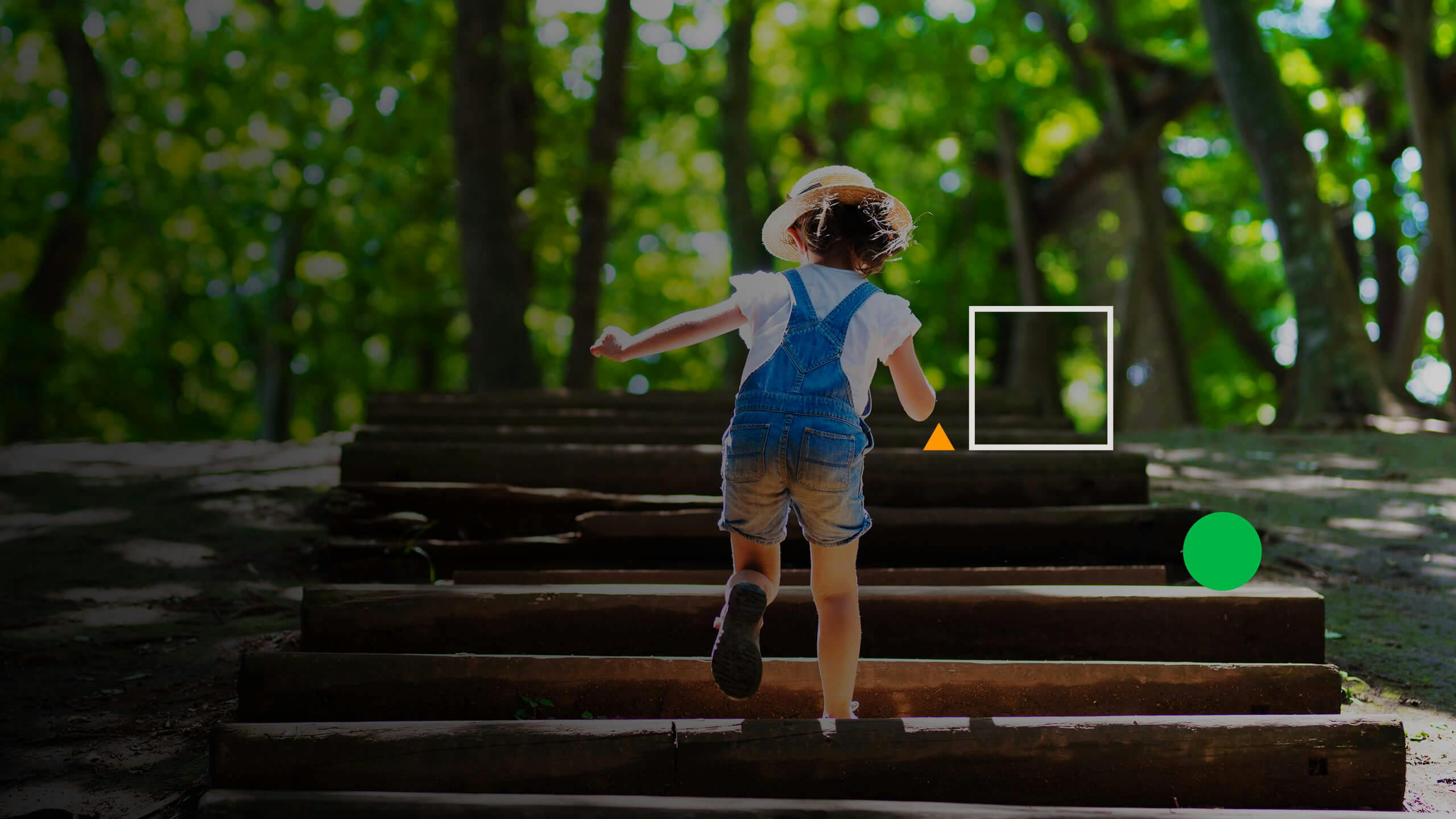 A kid walking upstairs in the park