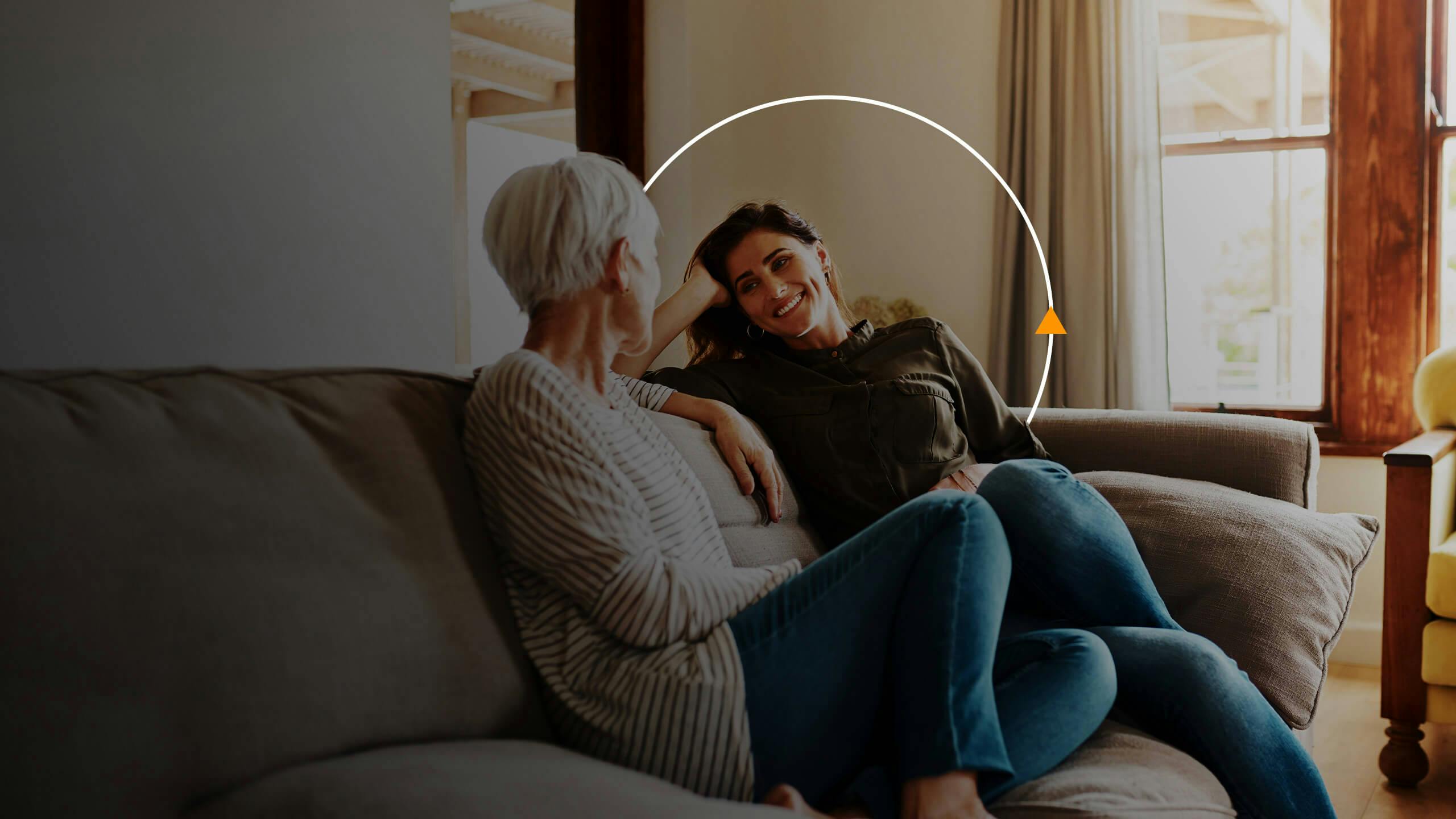 young woman having a conversation with her elderly mother