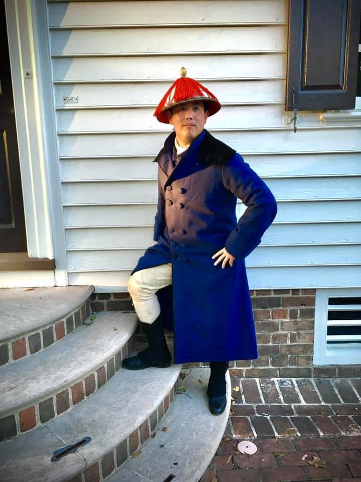 a historical interpreter in costume to discuss the "China Trade"
