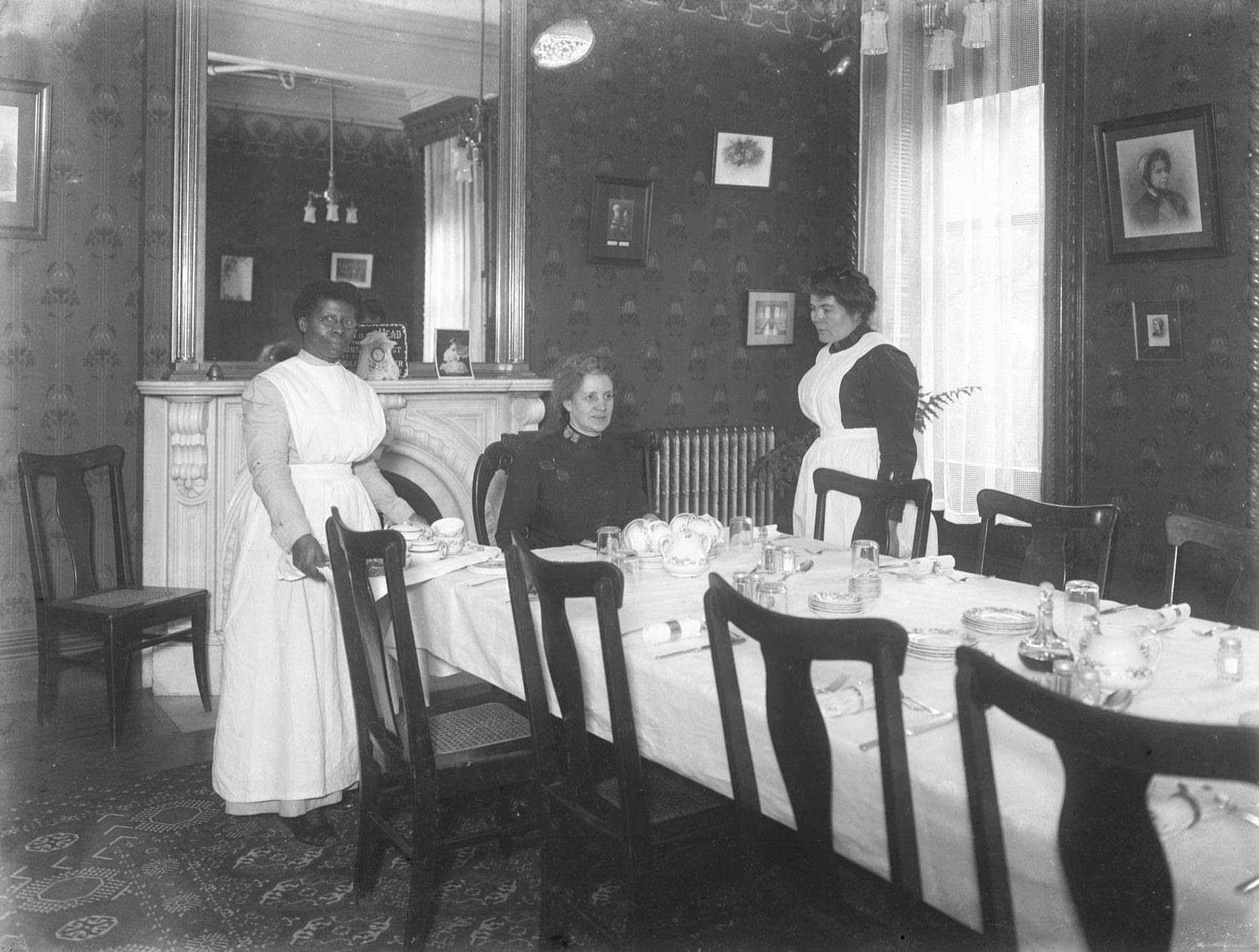Unidentified Salvation Army officer and two female servants in the Salvation Army Home on Gramercy Park, William Davis Hassler photograph collection, ca 1913, New-York Historical Society