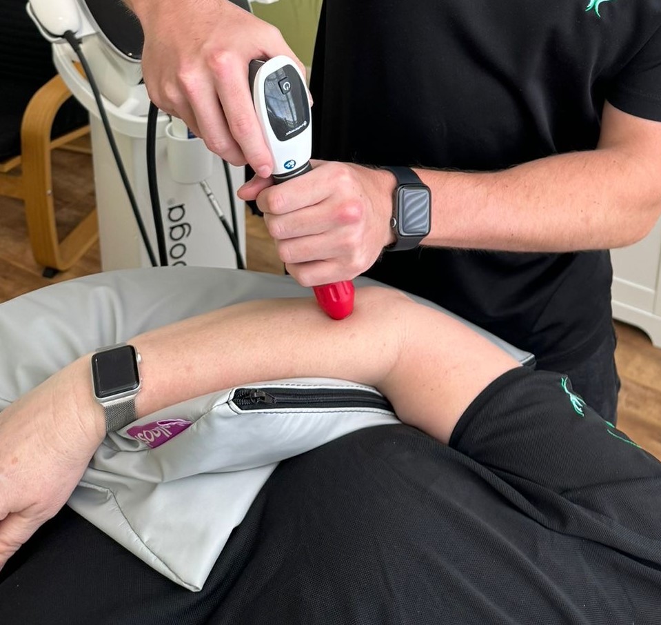 Shockwave therapy on a patients arm