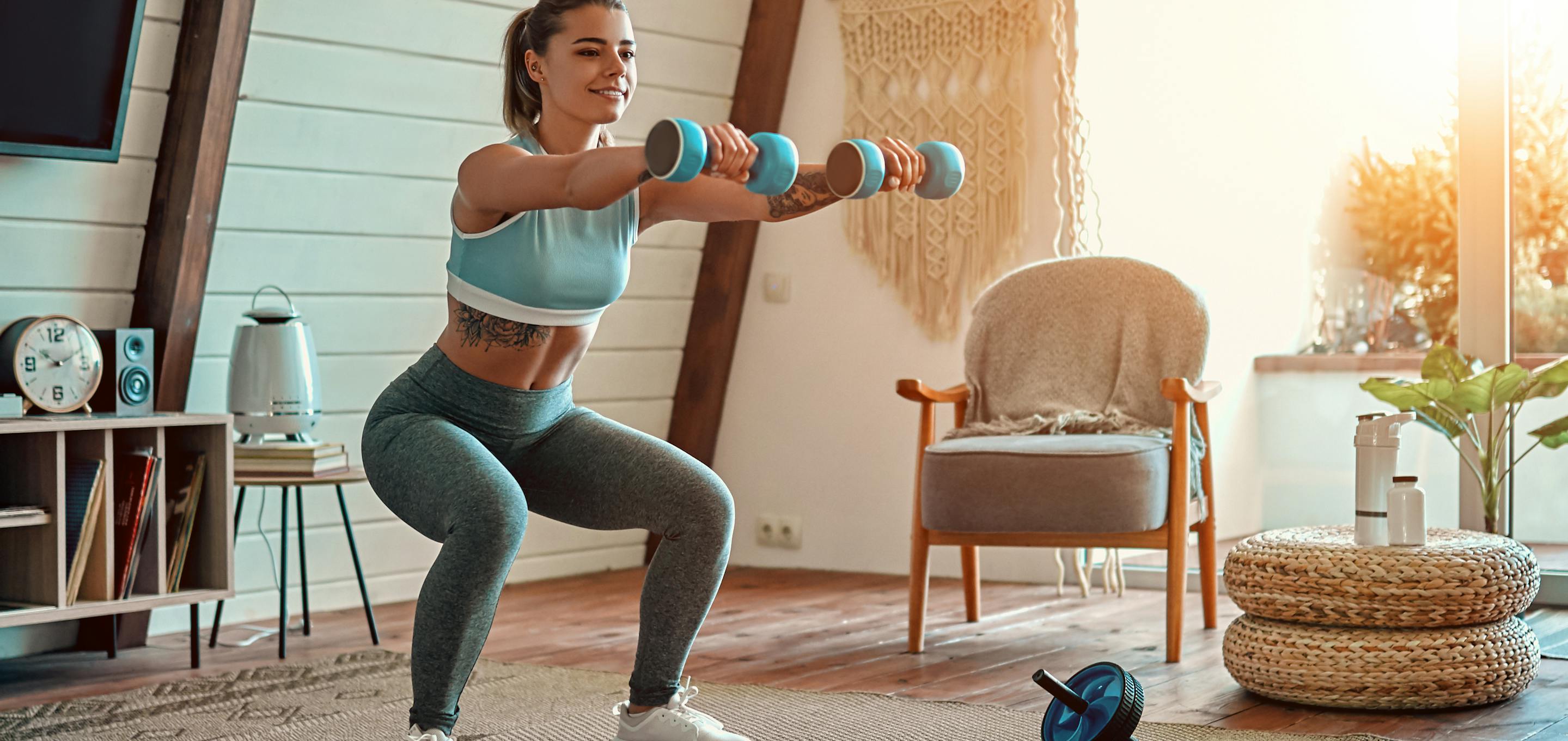 Woman doing exercise with dumbells