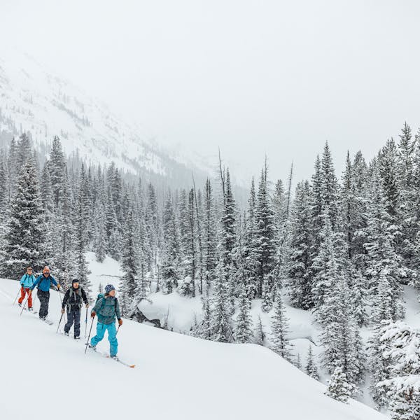 A group ski touring into the Montana backcountry with Oboz and Skida