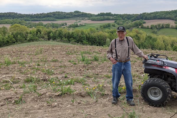 A farmer out in the field with his ATV