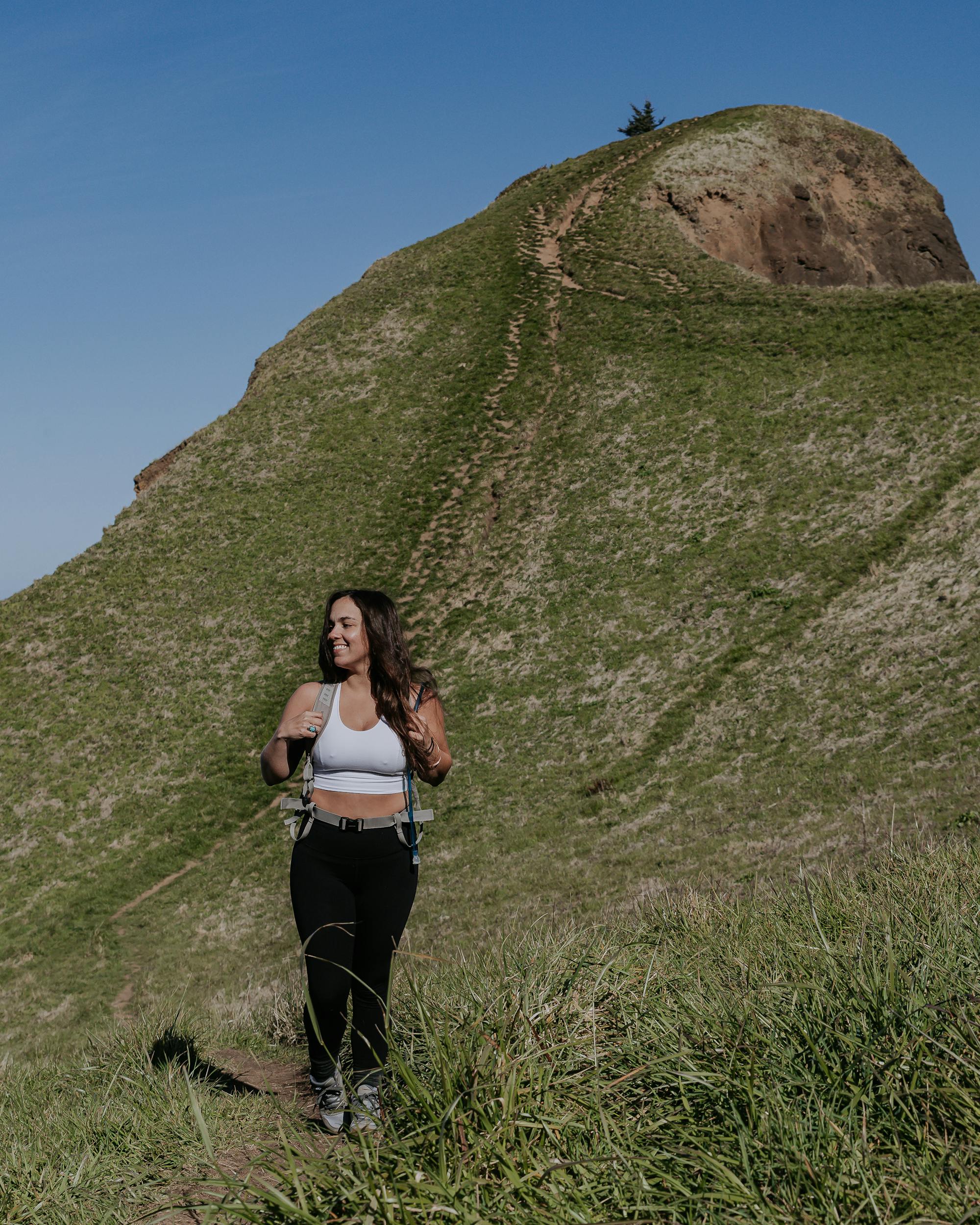 Lindsay Kagalis hiking in the Women's Bozeman Mids on Tillamook, Siletz, and Confederated Tribes of Grand Ronde Indigenous lands