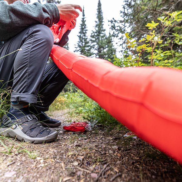 Setting up inflatable camp mattress in the Oboz Whakatā Trail Camp Sandal.