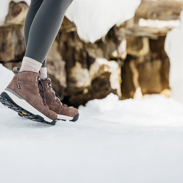 A person wearing the Women's Sphinx Mid Insulated Waterproof 