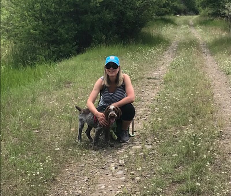Esther du Crocq on the trail with her loyal dog companion