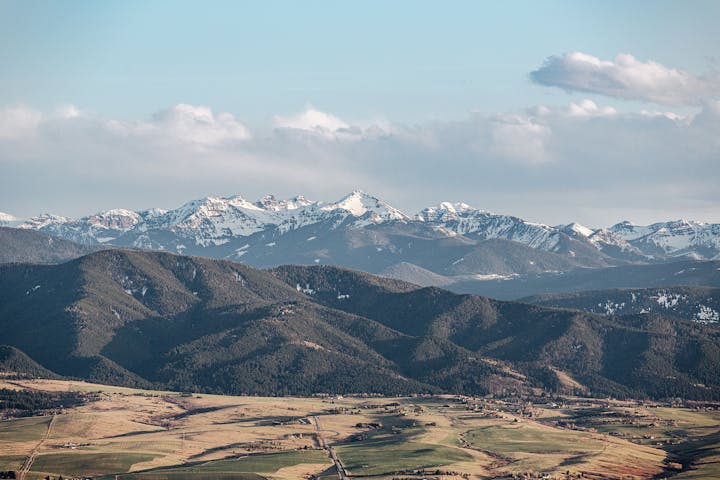 Snow covered mountains above the Gallatin Valley, home to the Oboz Footwear headquarters.