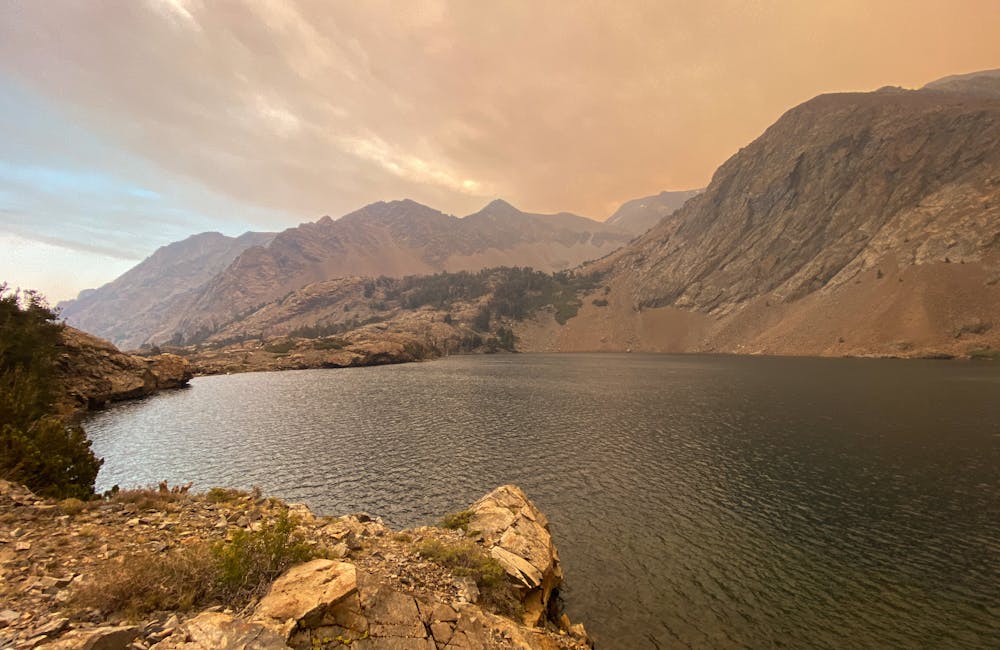 Views of Walter Lake and mountains with smoke in the air.