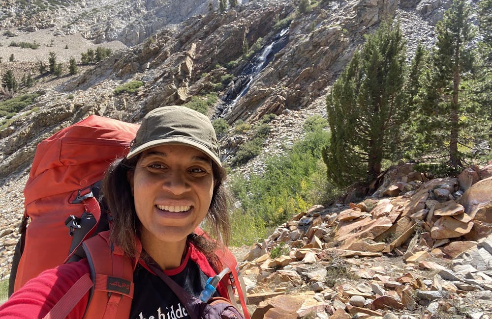 Brandy Brooks backpacking on trail