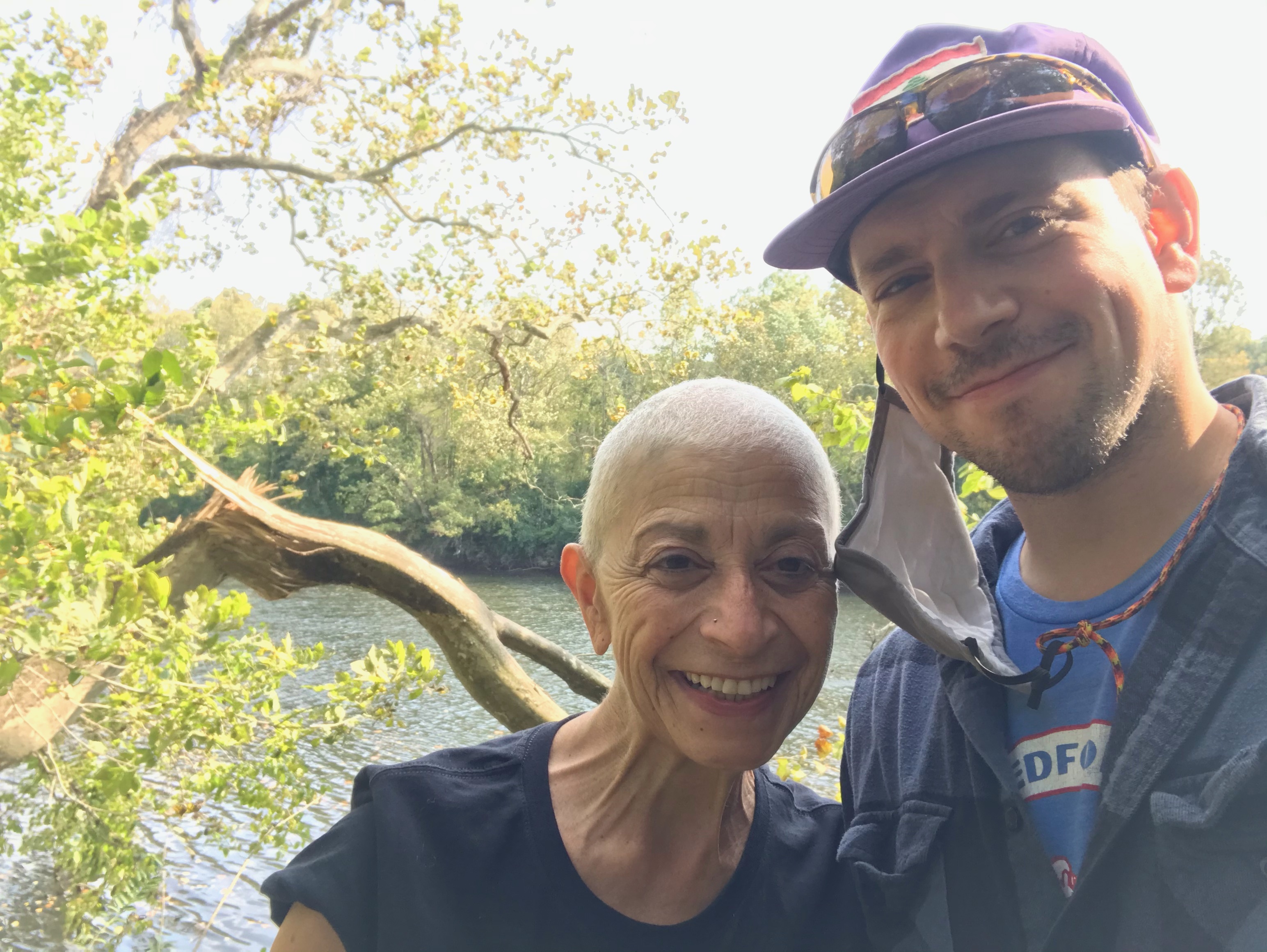 Alexi Kimiatek and his mother enjoying the sun near a body of water