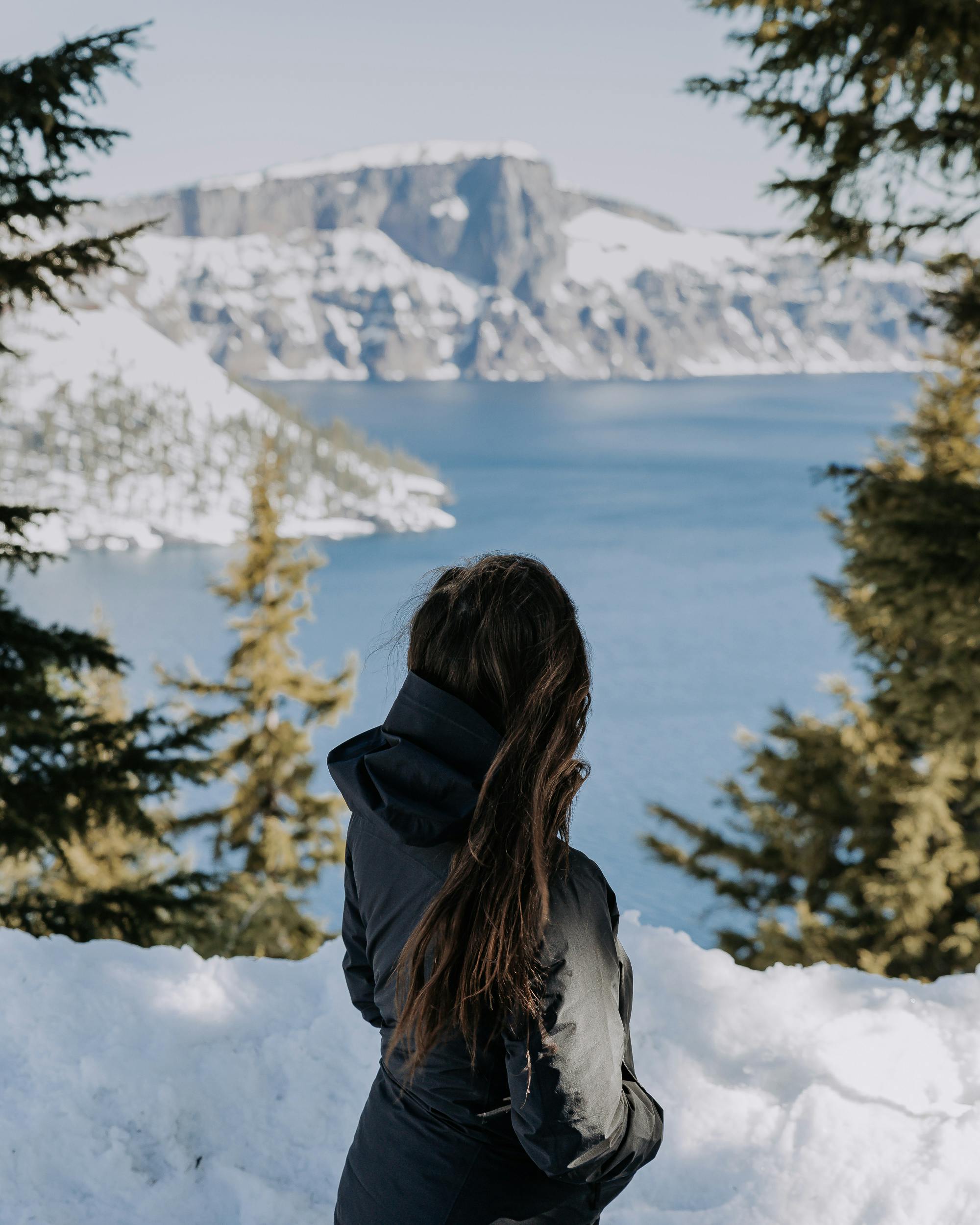 Lindsay Kagalis looking out at Crater Lake during the winter season