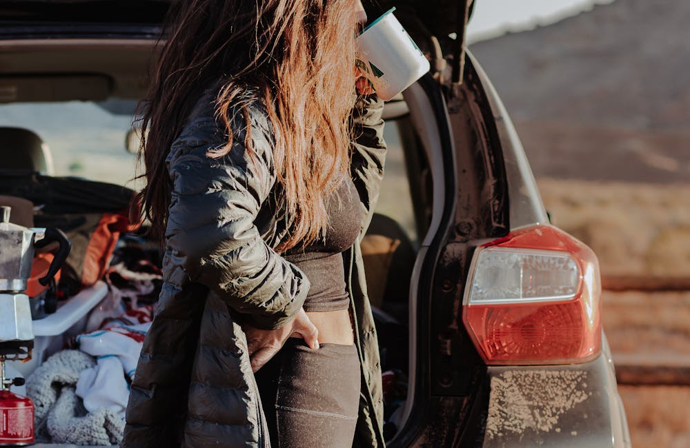 Woman sipping morning coffee in Capitol Reef National Park.