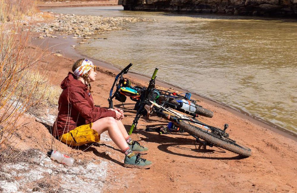 Oboz Trailblazer Ayla Mae Wild taking a break on a riverbank