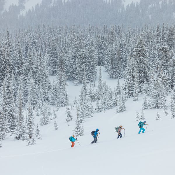 A group ski touring into the Montana backcountry with Oboz and Skida.