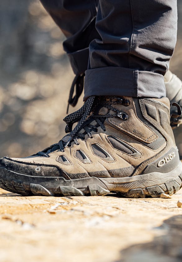 Men's Oboz Sawtooth X waterproof hiking boot on a rocky surface