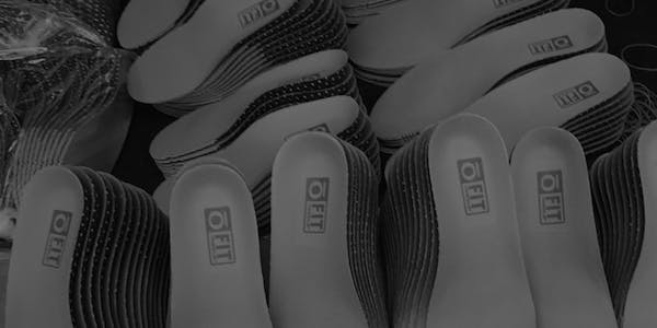 Stack of Oboz O Fit Insoles used in hiking boots.