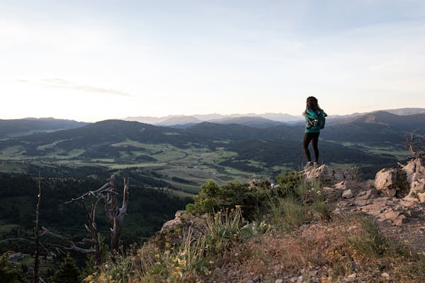 Jackie Nourse overlooking mountain ranges
