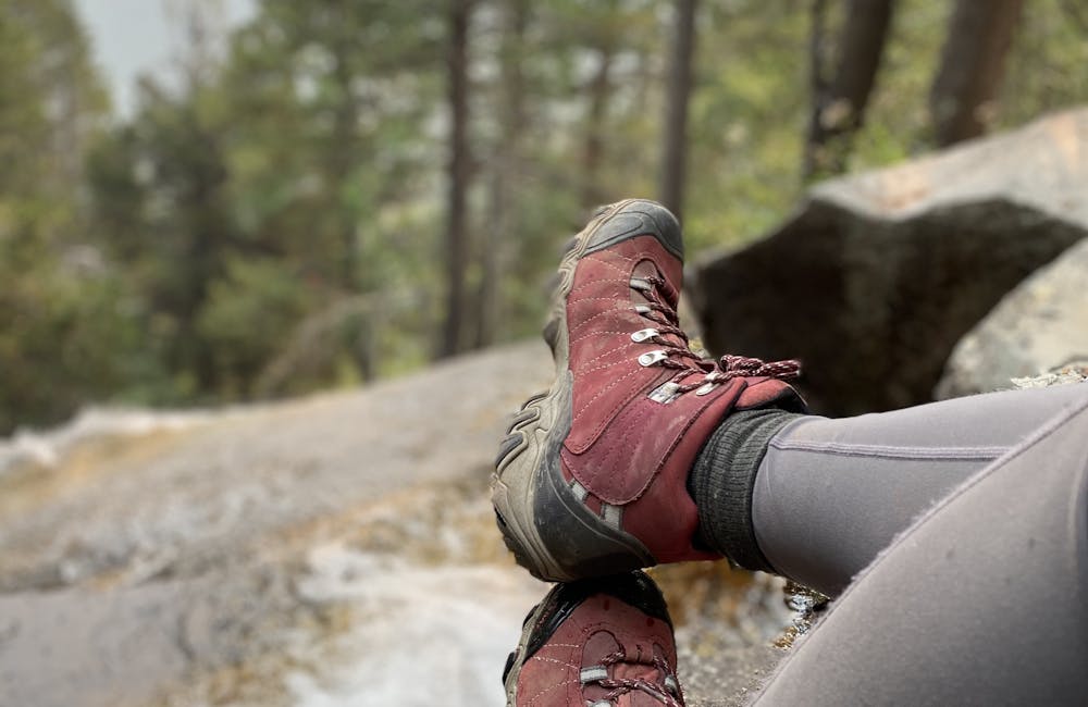 Brandy Brooks taking a break from hiking in her Rio Red Oboz Bridger Mid B Dry hiking boots.