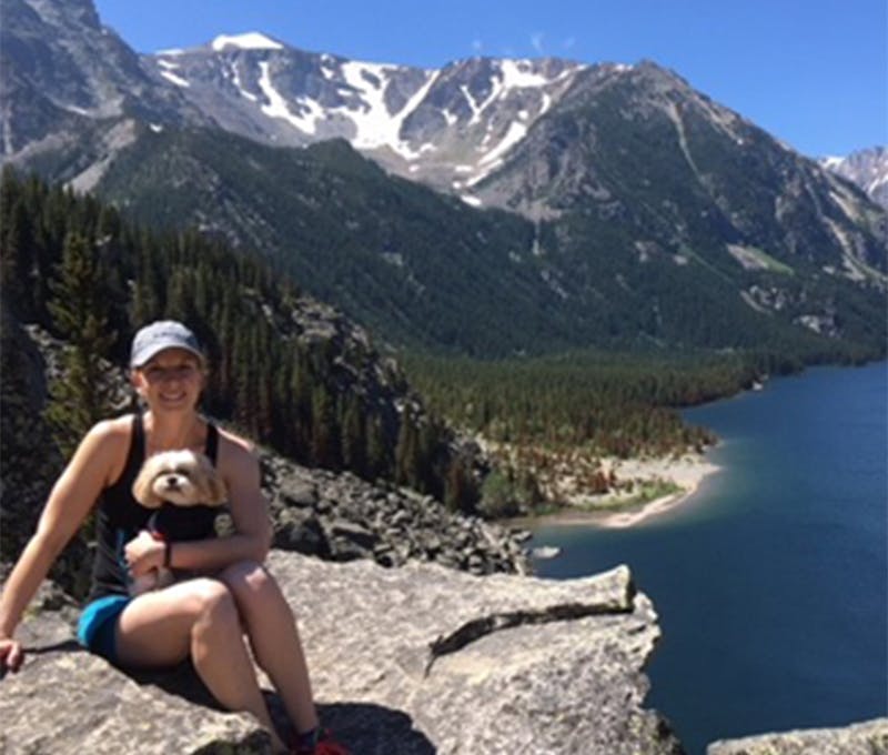 Erin Johnson with her dog on a hike