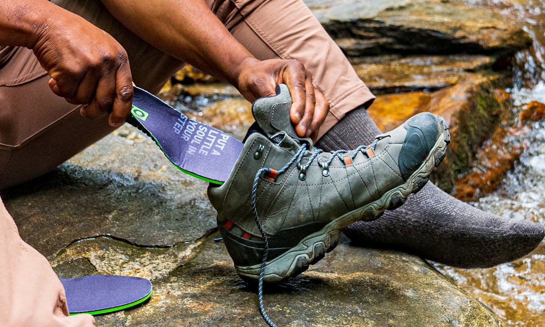 The Oboz + BFCT O FIT Insole® Plus Medium Arch 'Unity Blaze' placed into the Bridger Mid Hiking boots