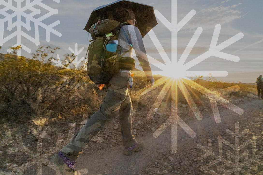 Man walking in the desert wearing a pair of Oboz Sawtooth X hiking boots