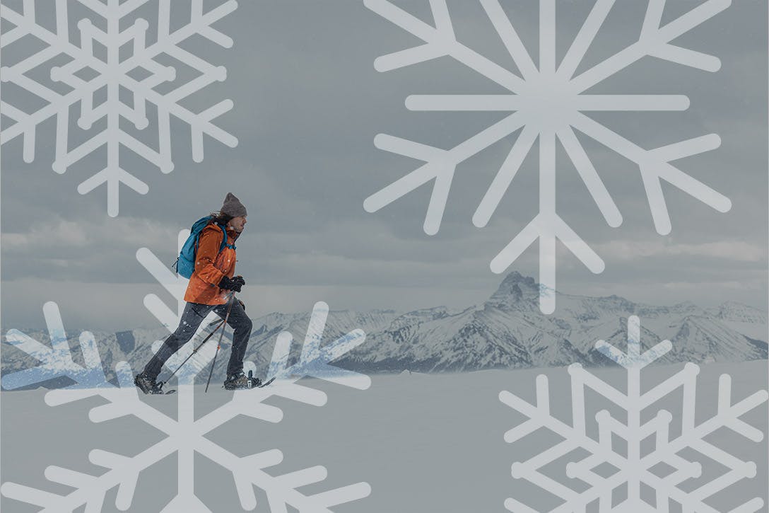 Person snowshoeing while wearing Oboz Bangtail winter boots