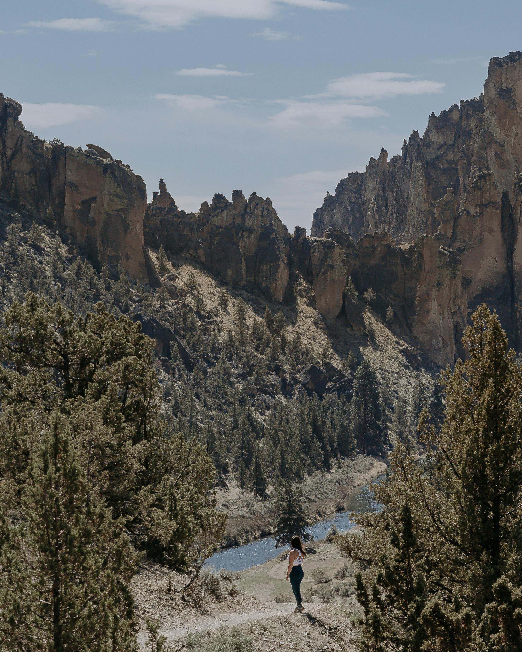 Lindsay Kagalls checking out views of the river while hiking on trail in the Oboz Women's Bozeman Mids