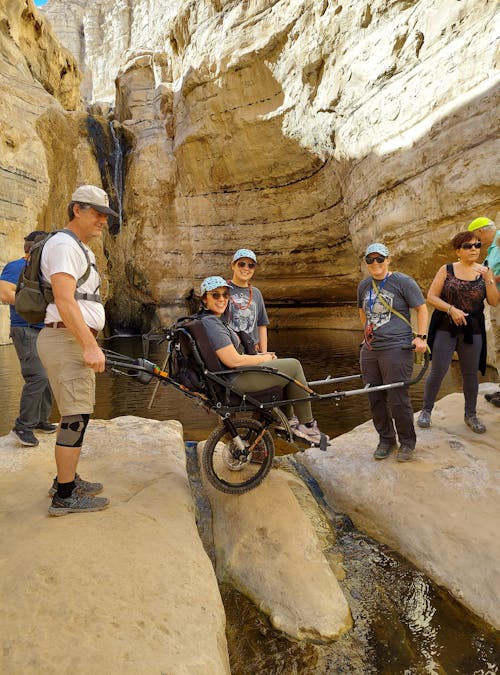 Members of Kevin Schwieger's organization, Luke5Adventures, cross a creek in Israel.