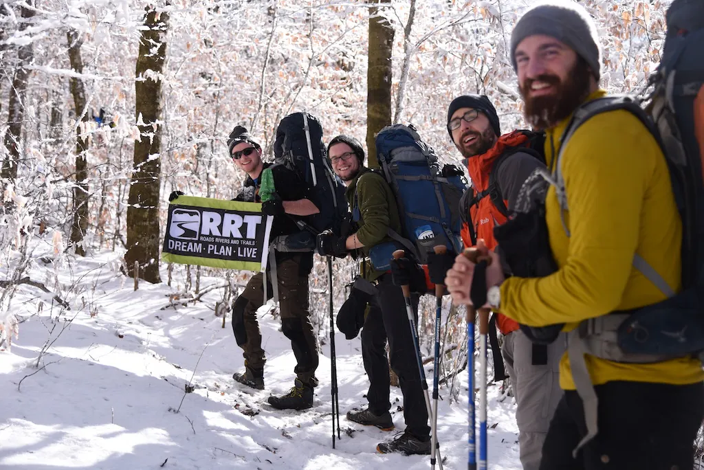 A hiking crew from RRT head up a snowy trail.
