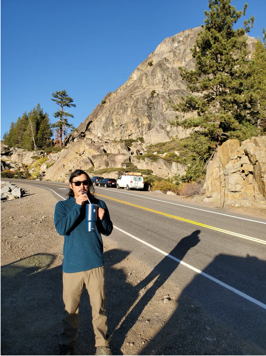 Tyler Lau on an adventure through the mountains in his Oboz hiking shoes.