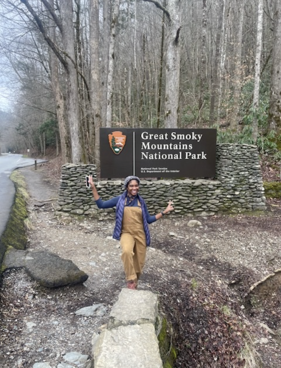 K. Walker in front of the entry sign to Great Smoky Mountains National Park