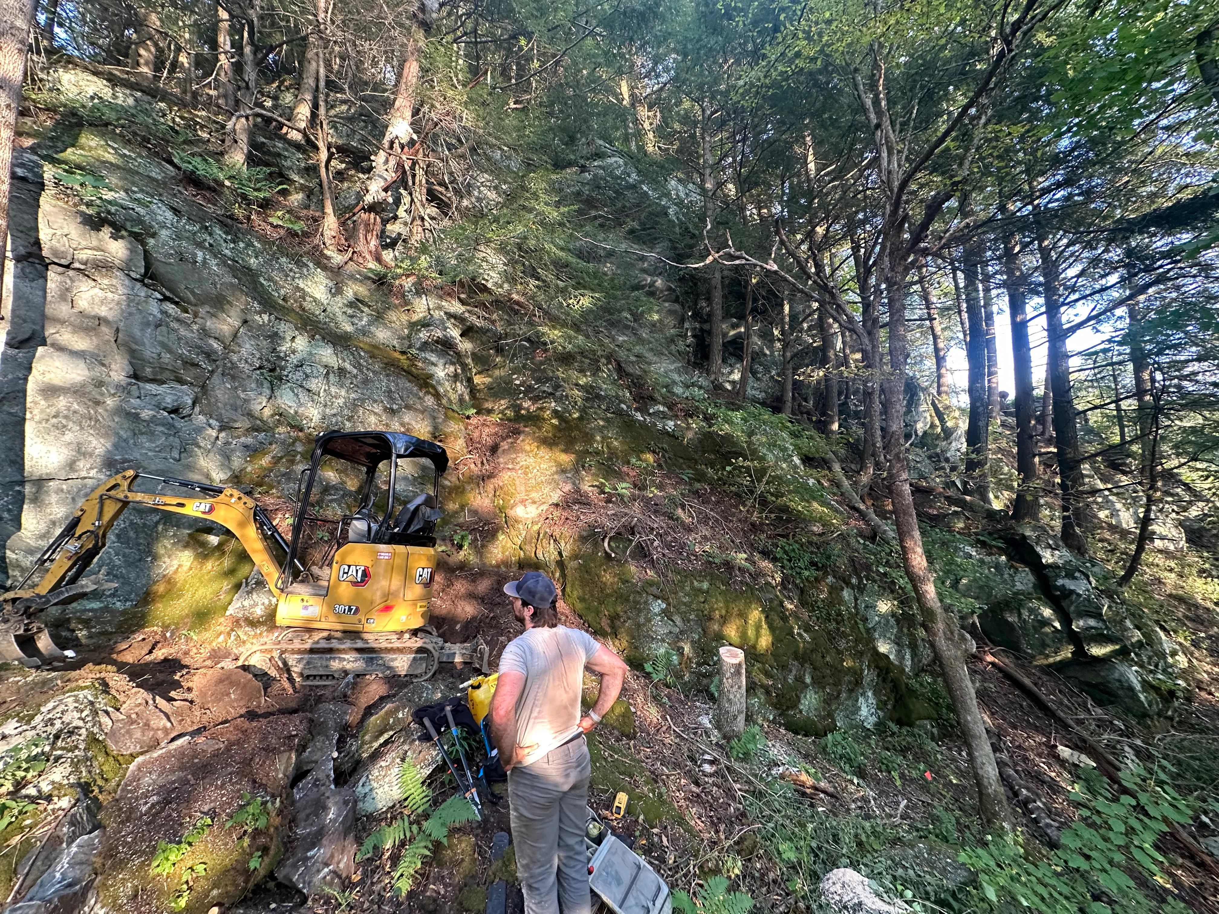Trail workers with a bulldozer building a new trail system in Bolton, VT