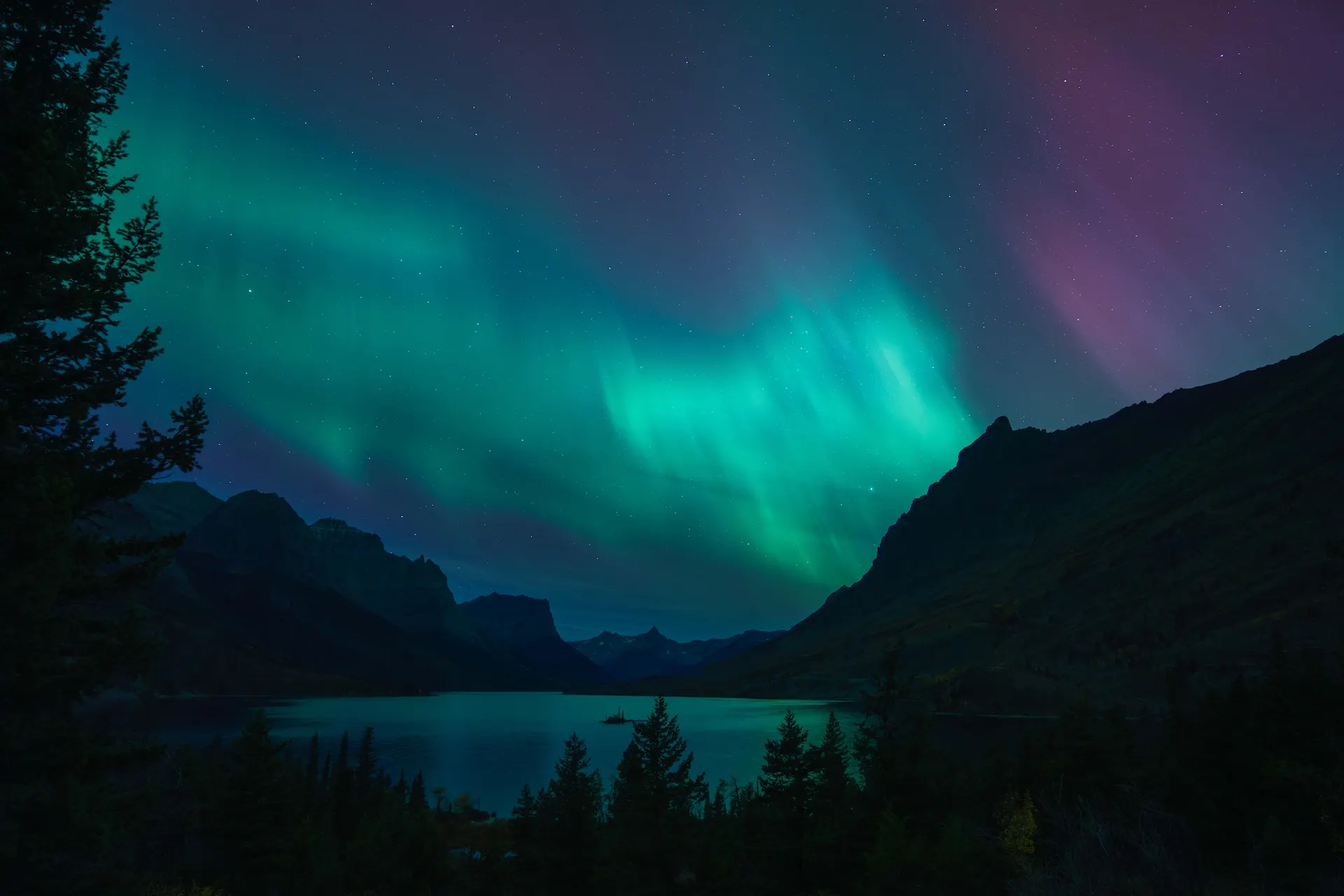 The northern lights against the iconic landscape of Glacier National Park