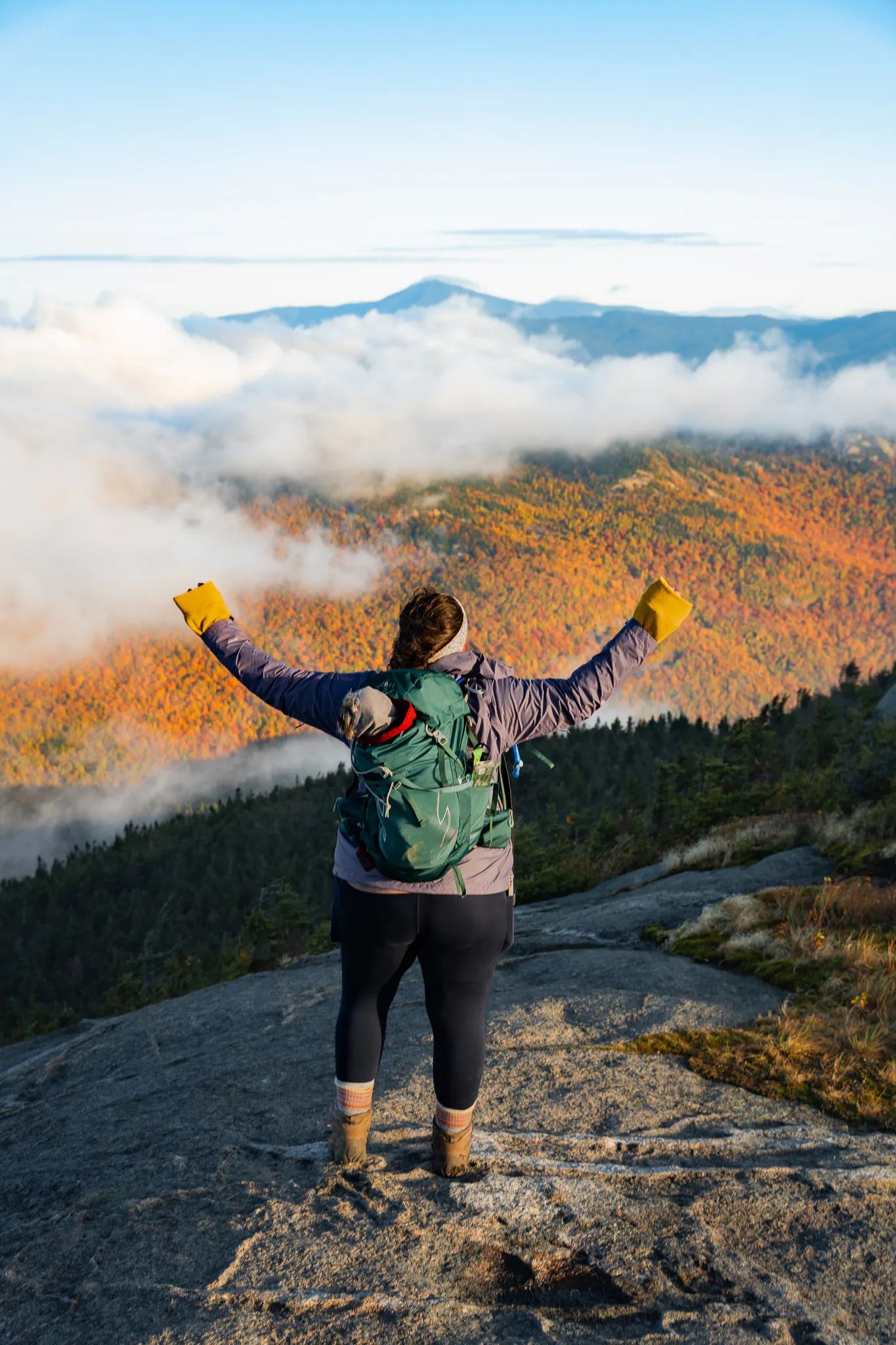 A hiker enjoying fall colors in New England in Oboz Footwear