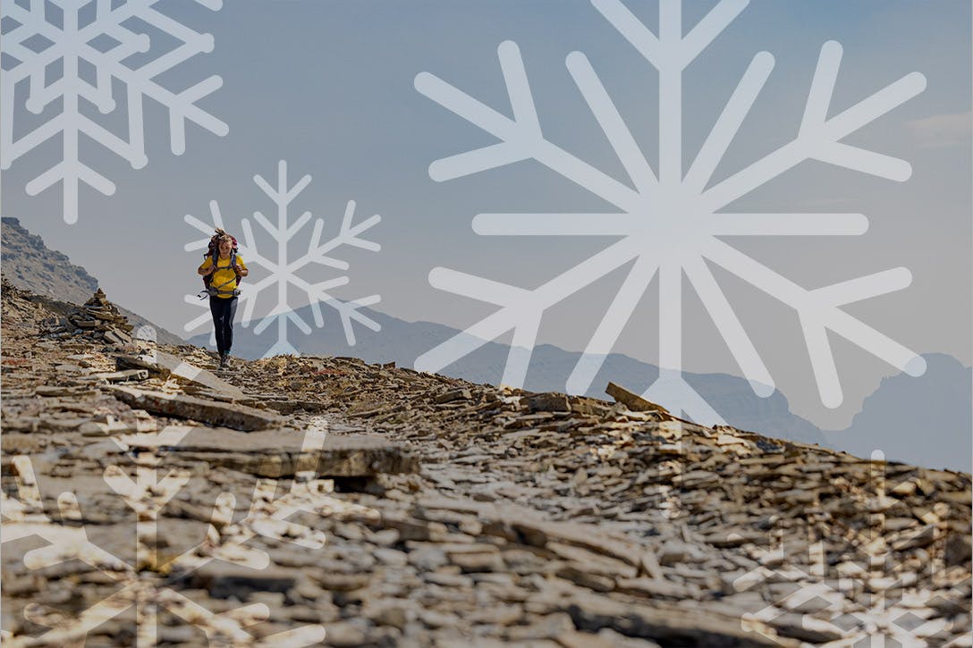 Woman hiking a rocky pass in Oboz hiking boots