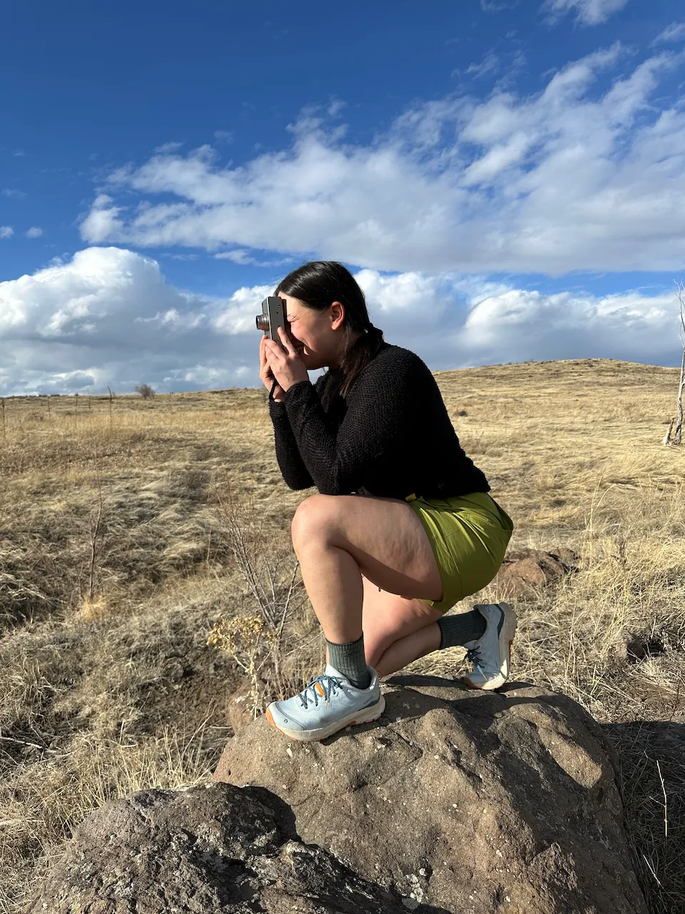 Kylie on the Catalina trail taking a photo in her Oboz Katabatic