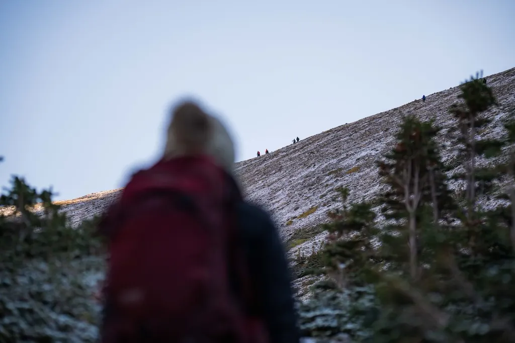 View of hikers on Siyeh Pass in Glacier National Park