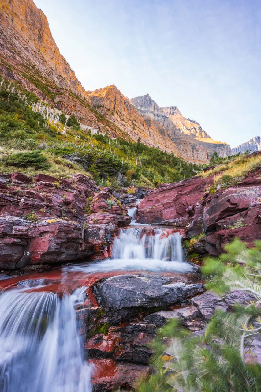 A waterfall flowing through Siyeh Pass in Glacier National Park